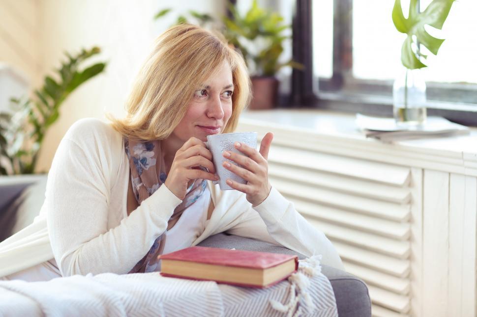 Free Image of Woman at home with warm mug 