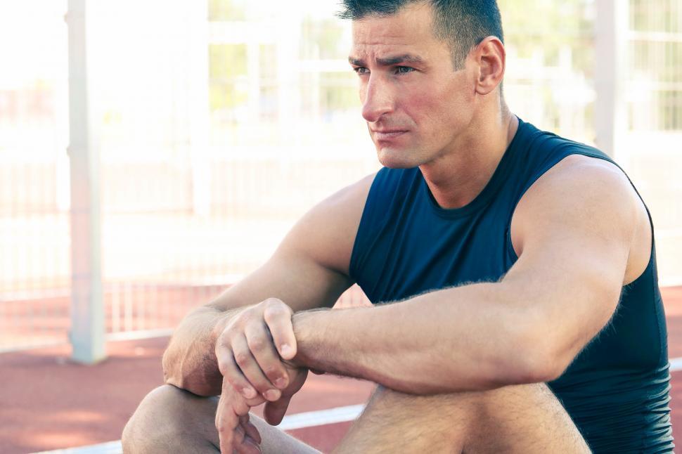 Free Image of Athletic man sitting 