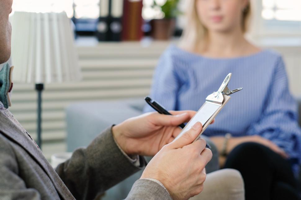 Free Image of Psychologist taking notes 