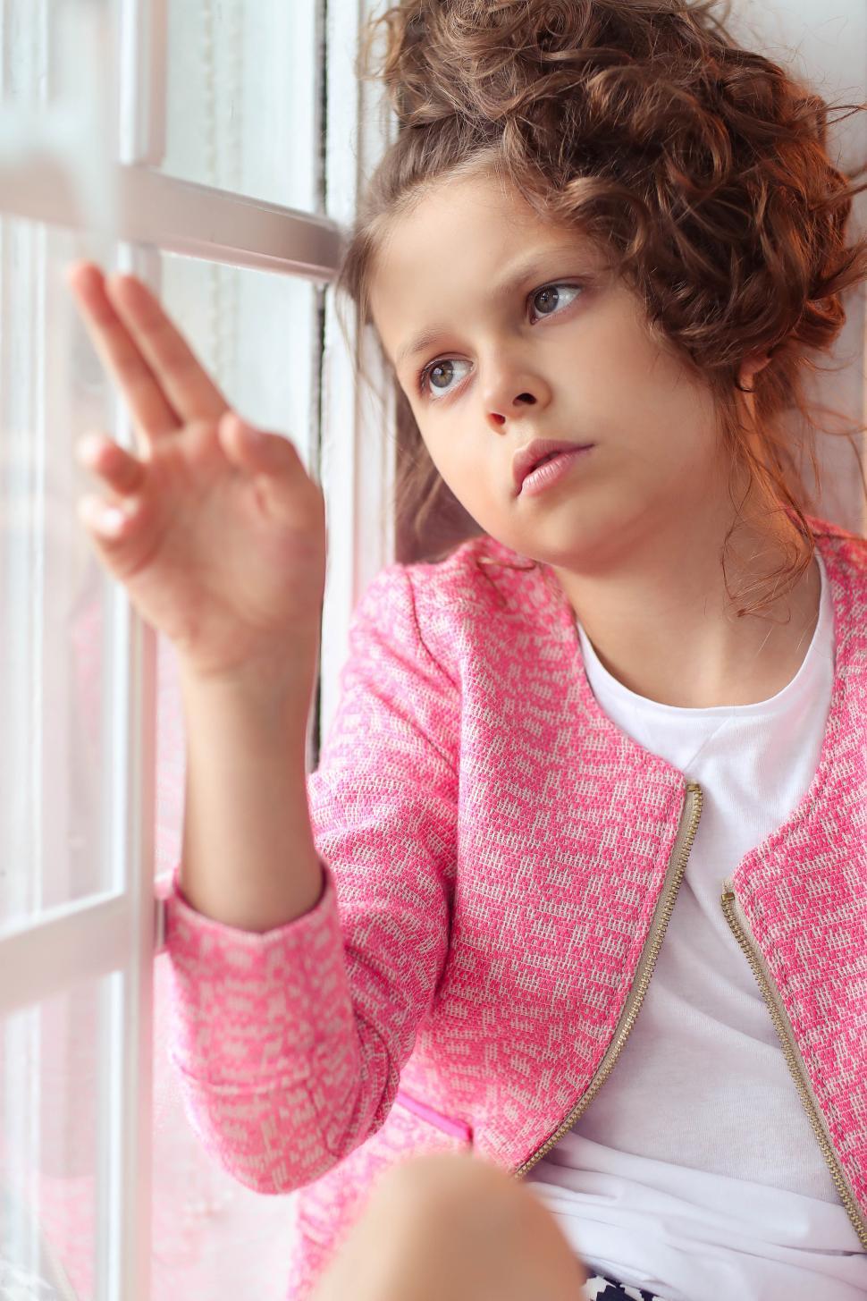 Free Image of Female child looking wistful or distracted 