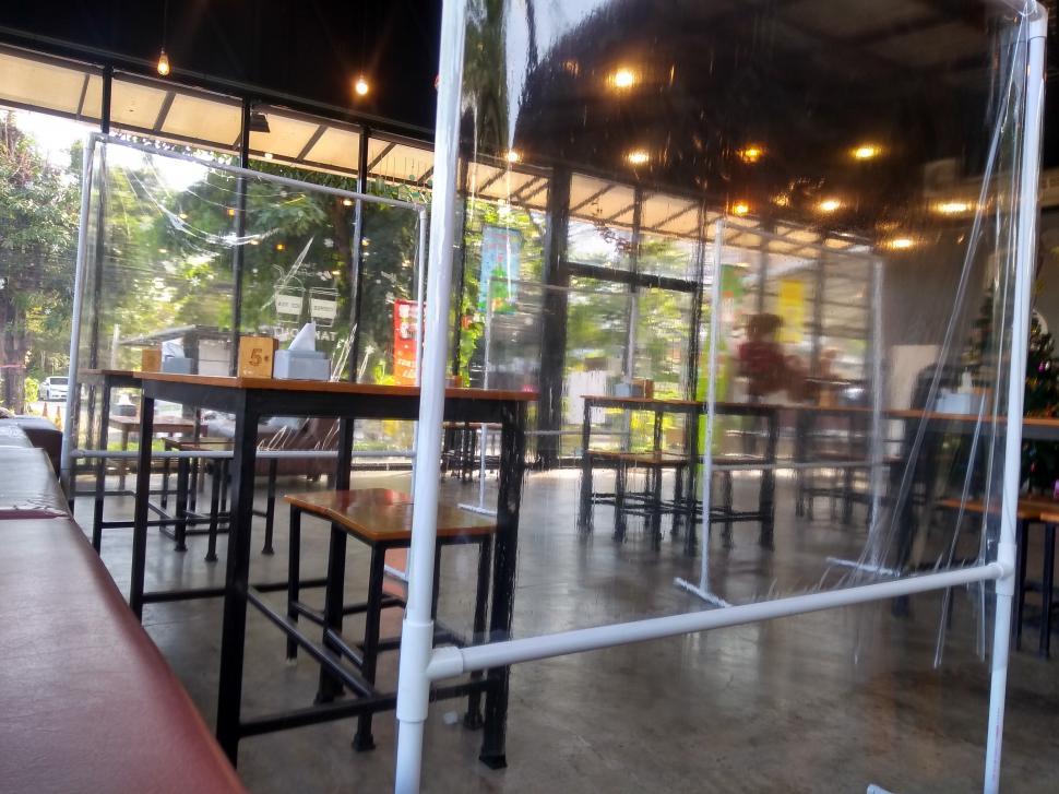 Free Image of Cafe interior plastic screens separate tables  
