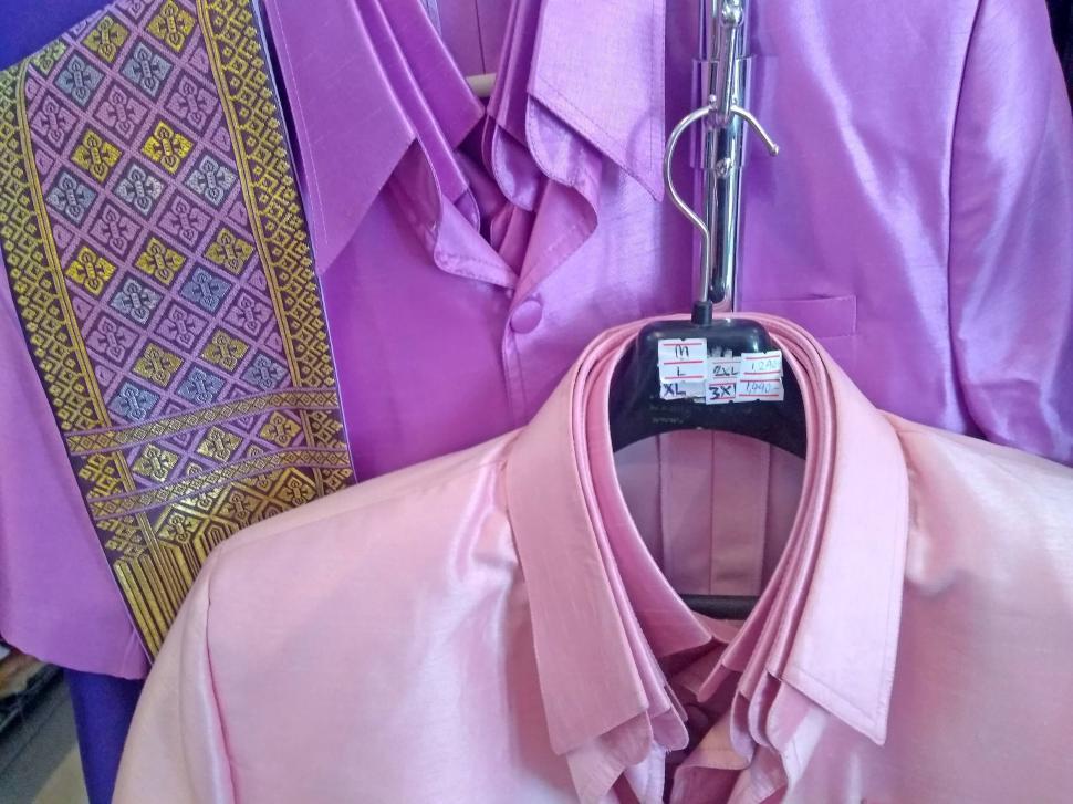 Free Image of Pink and purple shirts in a store  