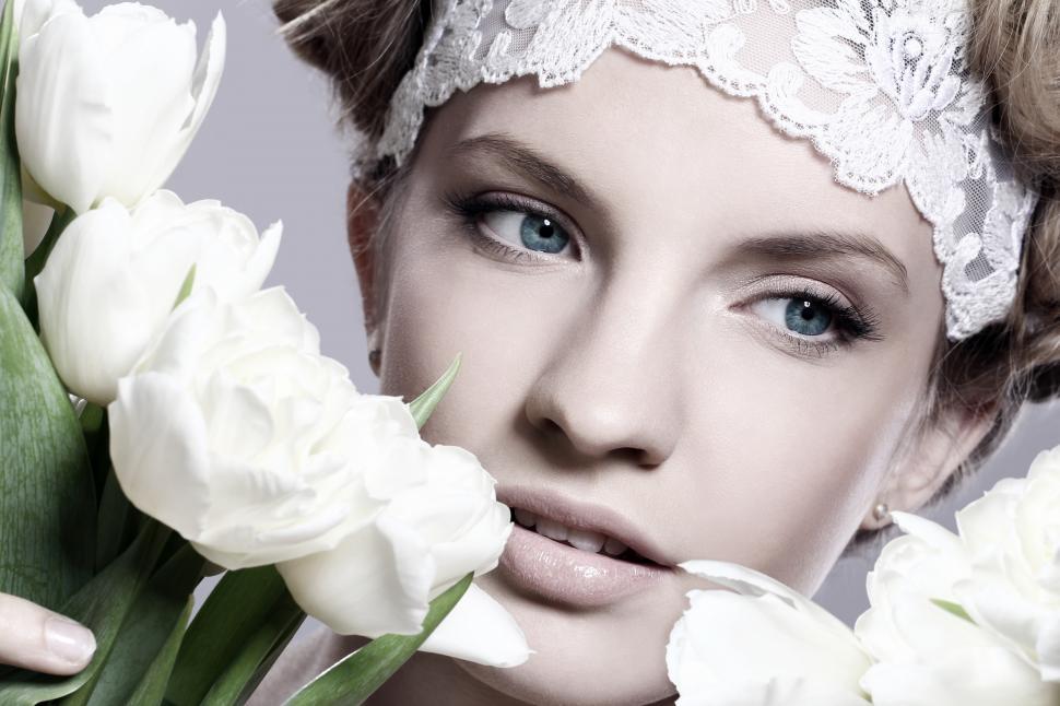 Free Image of Woman framed by white tulips 