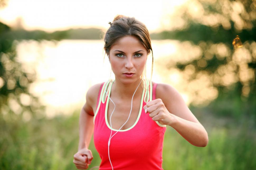 Free Image of Healthy young woman on an evening jog 