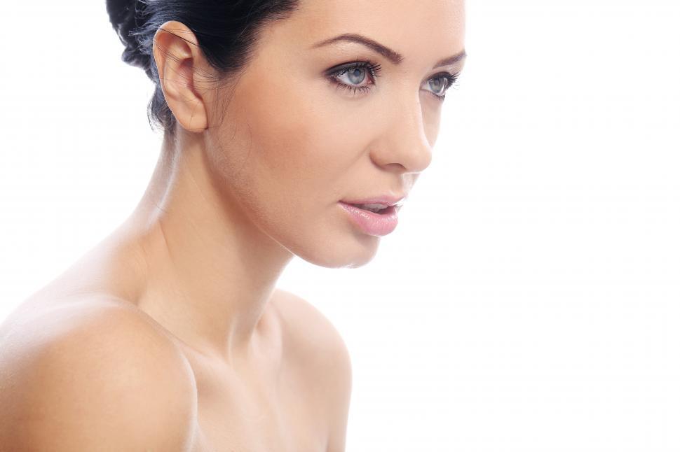Free Image of Attractive young woman, dark hair, looking off frame 