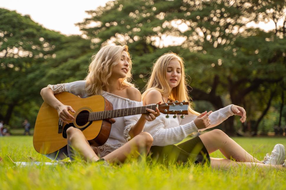 Free Image of Young women singing in the park 