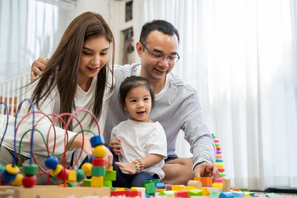Free Image of Happy young father and mother and a little daughter 