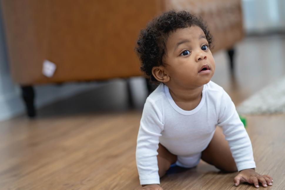 Free Image of Adorable baby boy crawling 