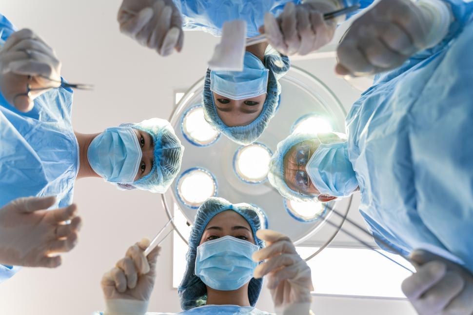 Free Image of Medical Team Performing Surgery, Looking Down 