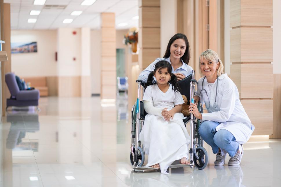 Free Image of Pediatrician and patient family portrait  