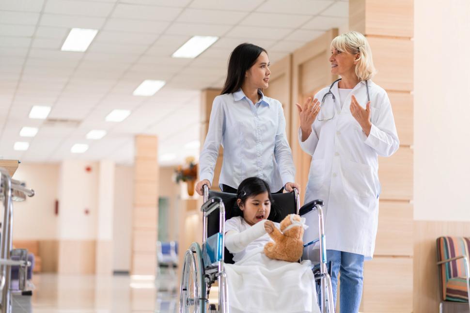 Free Image of Family and doctor consult in hospital 