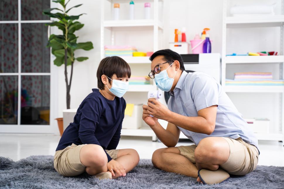 Free Image of Father and child monitoring body temperature 