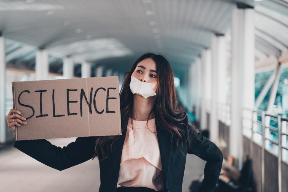 Free Image of Asian woman activists with sign, protesting 