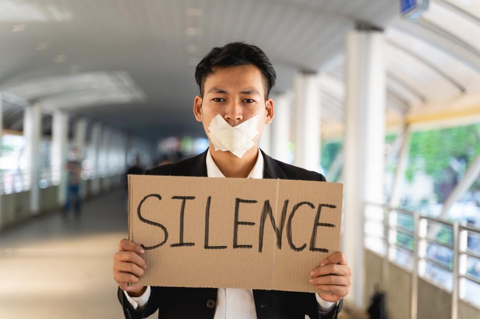 Free Image of Asian activist with sign protesting for democracy and equality 