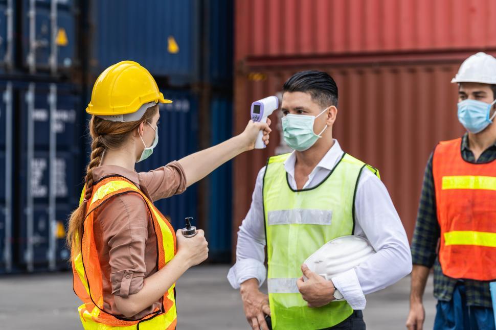 Free Image of Dock worker getting temperature check 