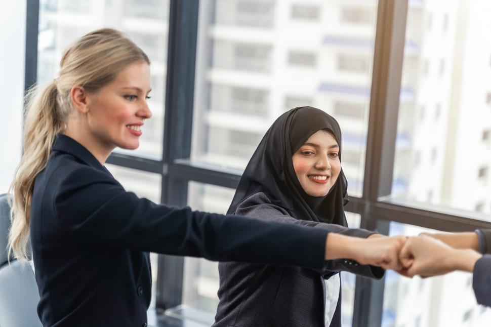 Free Image of Business team showing unity with their hands together 