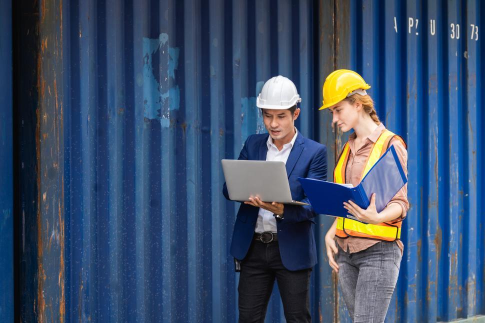 Free Image of Two engineers looking at specifications 