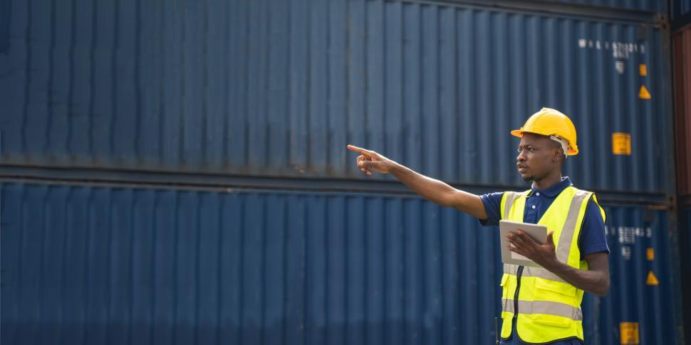 Free Image of Man directing shipments 