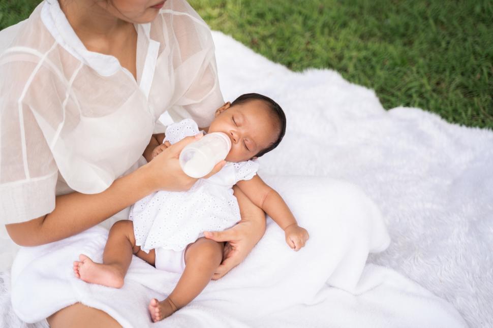 Free Image of Asian mother holding her newborn 