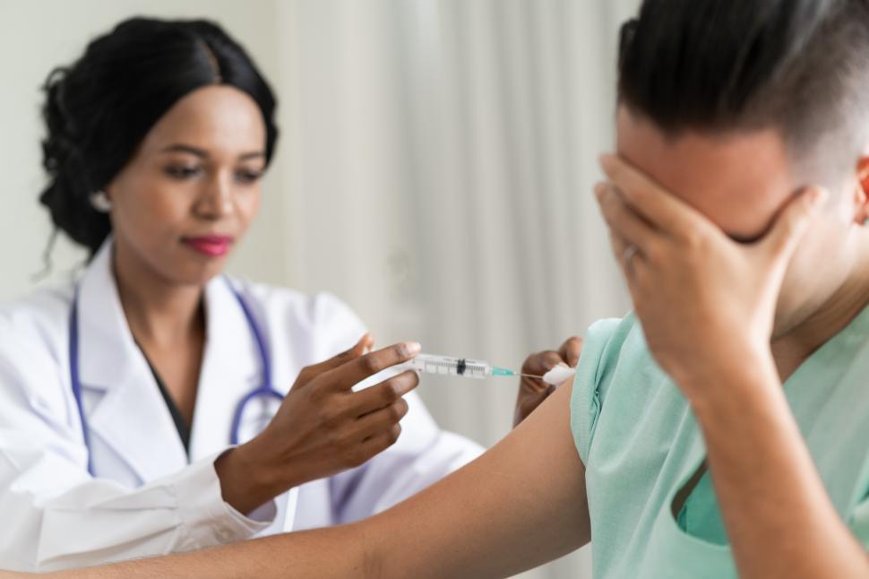 Free Image of Doctor vaccinating patient 