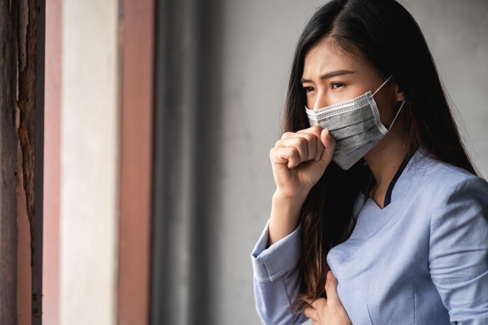 Free Image of COVID-19 Pandemic Coronavirus, woman has a cough 
