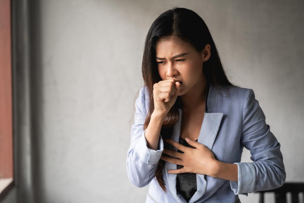 Free Image of Woman with a cold and cough 