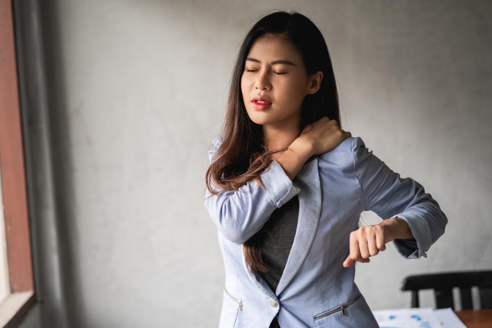 Free Image of Woman has a neck ache 