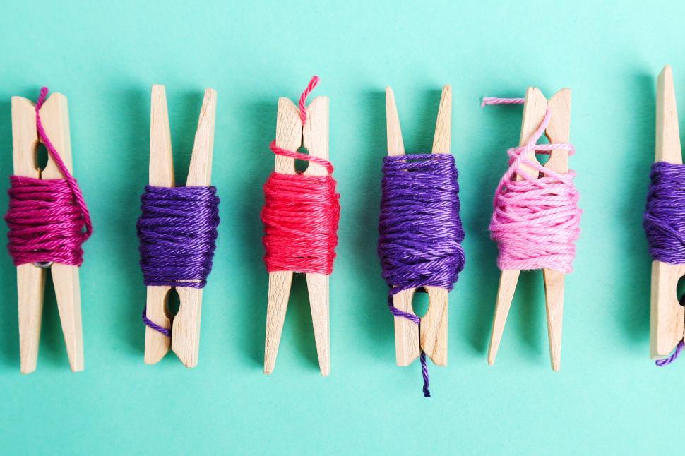 Free Image of Thread wrapped wooden clothes pins 