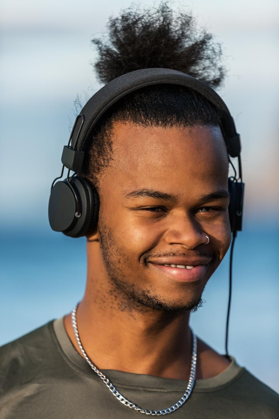 Free Image of Smiling black guy in headphones 