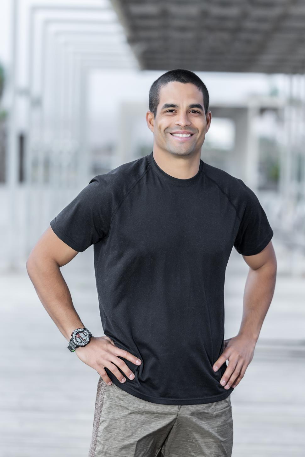 Free Image of Handsome personal trainer with friendly smile 