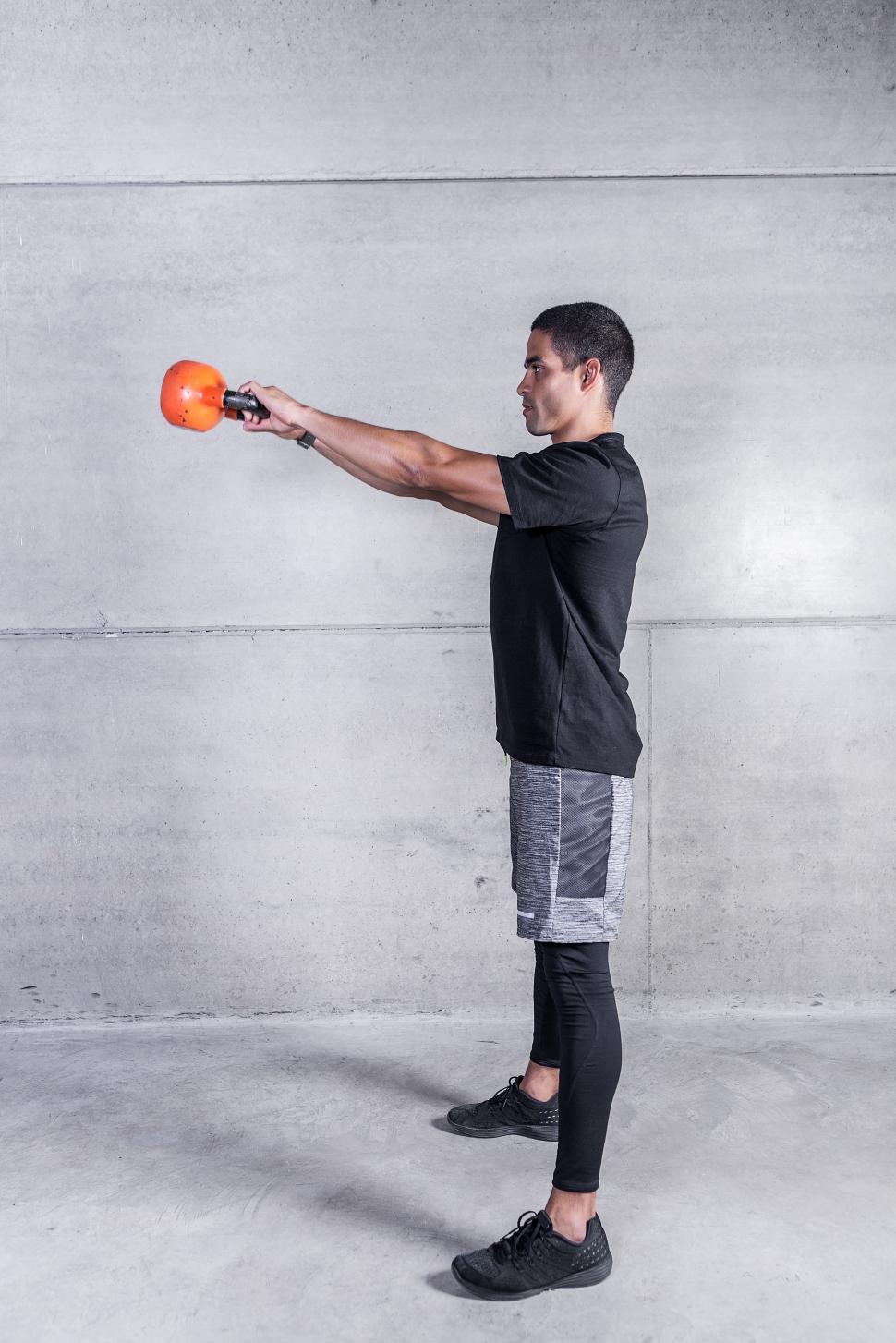 Free Image of Man doing kettlebell swings 