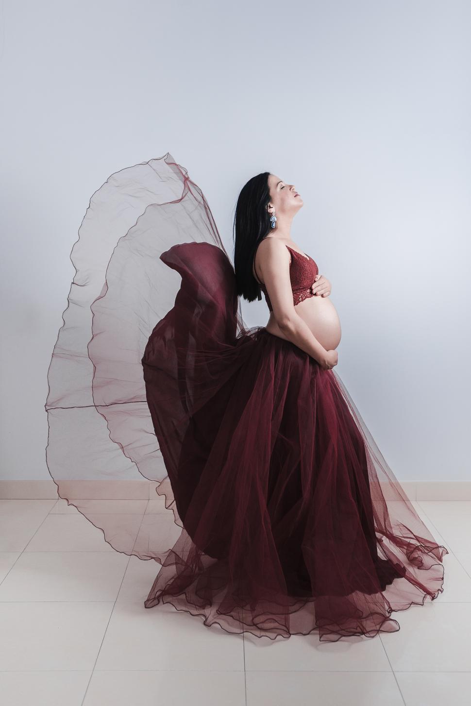 Free Image of Pregnant lady with waving skirt 