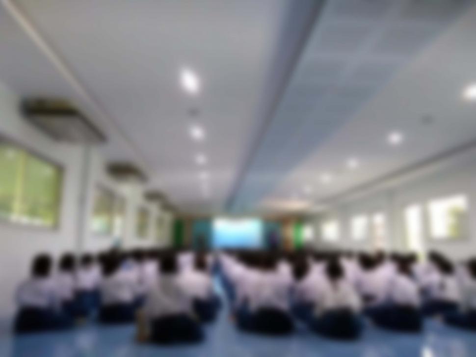 Free Image of Students sitting in a room blurred background  