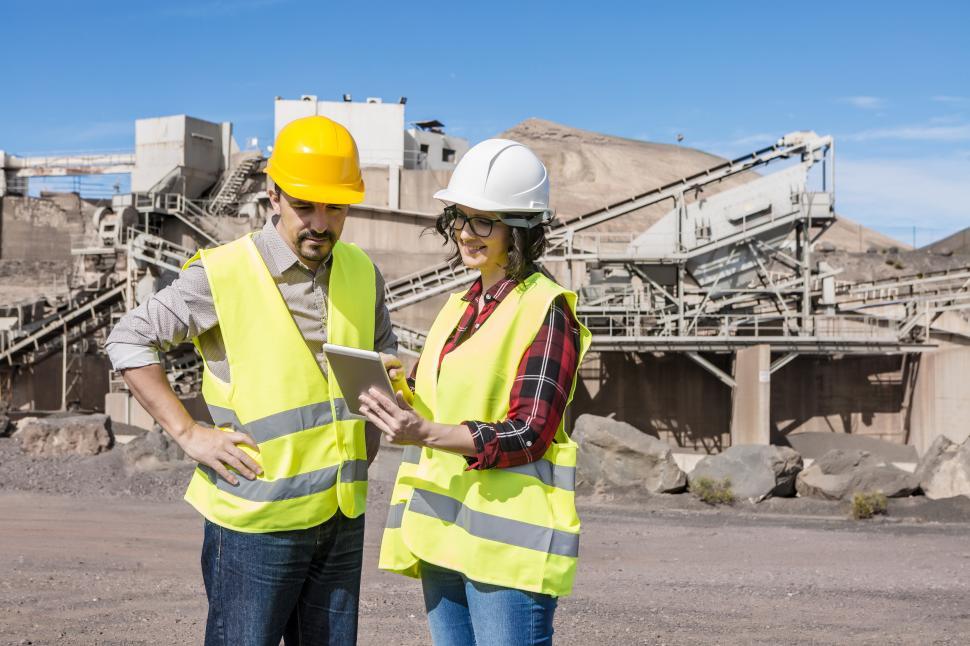 Free Image of Construction engineers with tablet discussing draft 