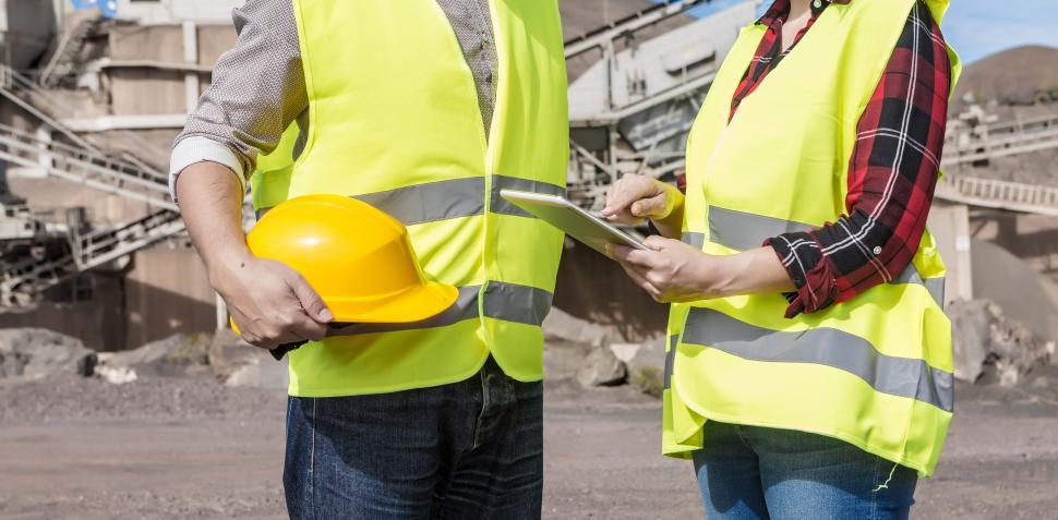 Free Image of Engineers with tablet having meeting on industrial facility 
