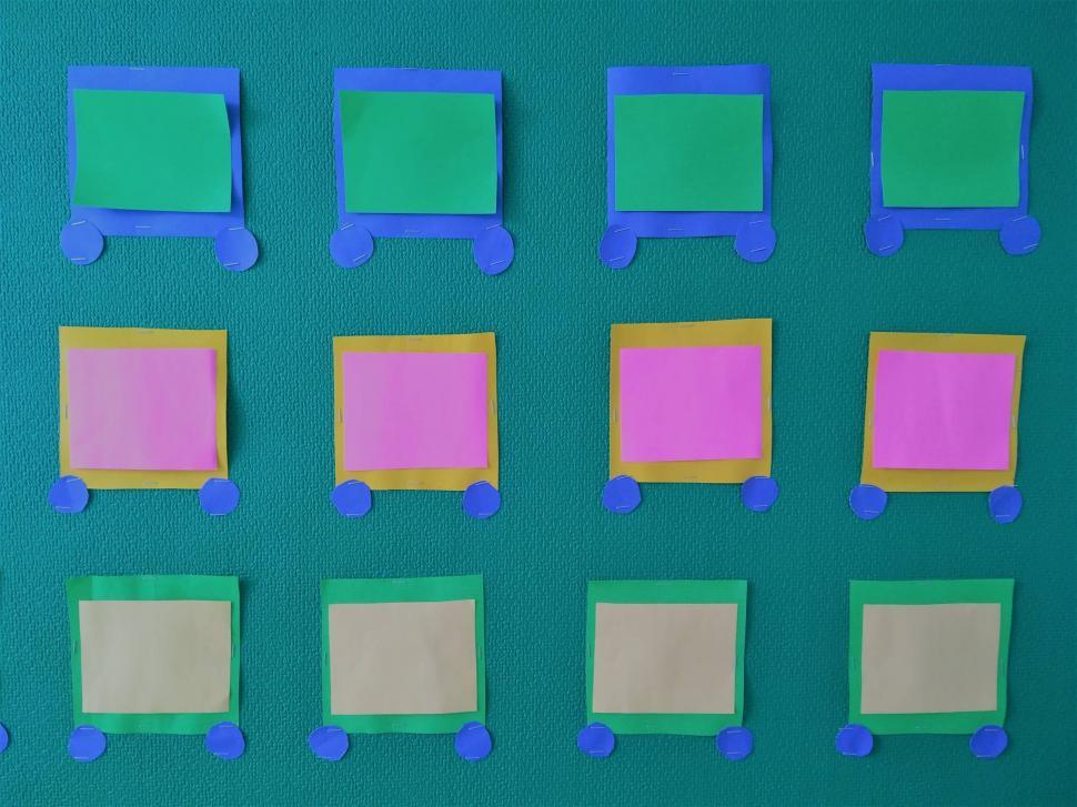 Free Image of Grid of Blank Paper Notes on a Noticeboard  