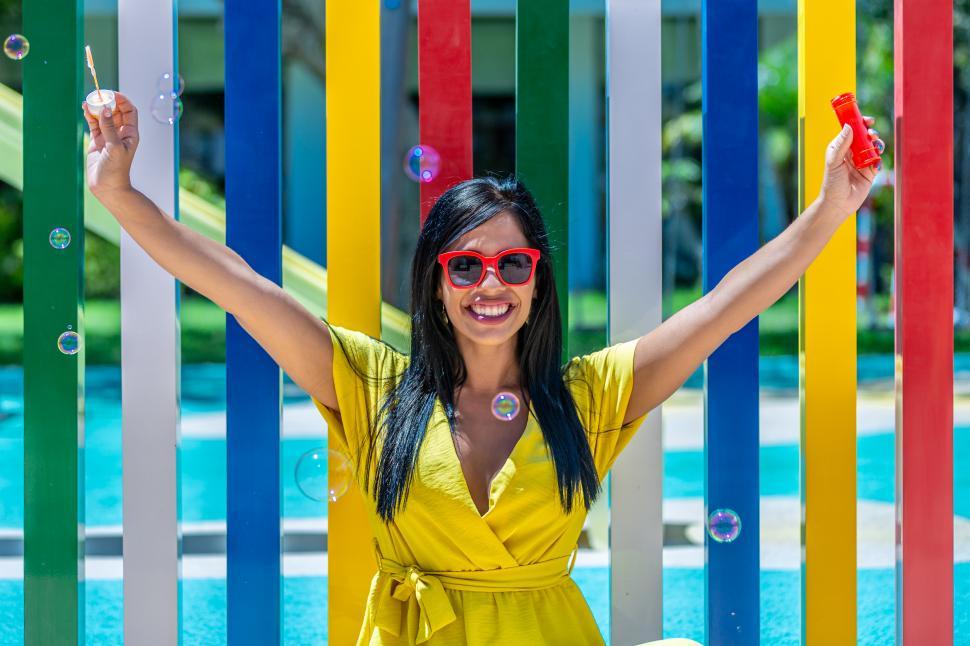 Free Image of Latina woman smiling with her arms outstretched 