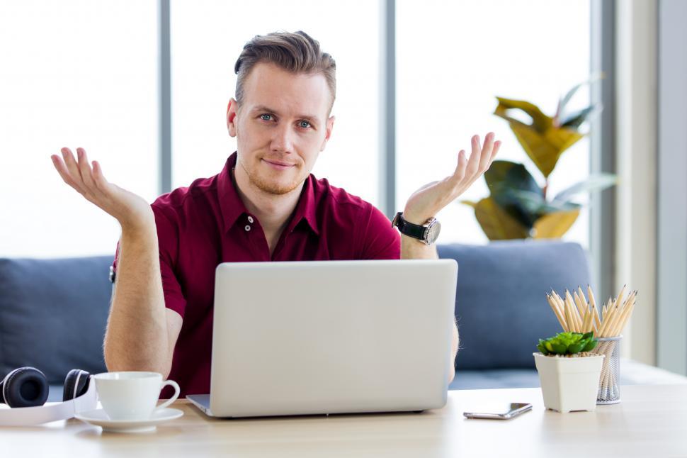 Free Image of Man is working on laptop at home. 