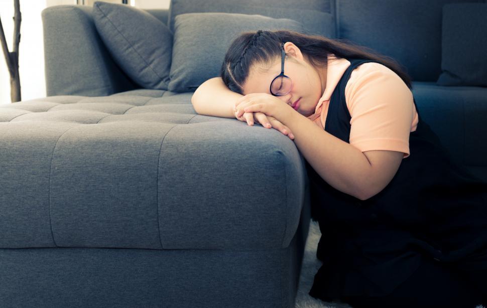Free Image of Lonely girl at home. Autism kids concept. 