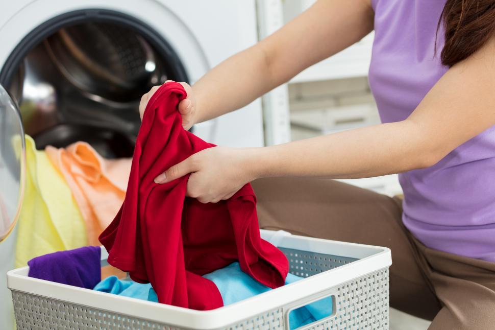 Free Image of Woman s hand is rubbing the cloth to remove the dirt 