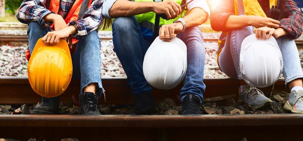 Free Image of Industrial workers holding hard hats 