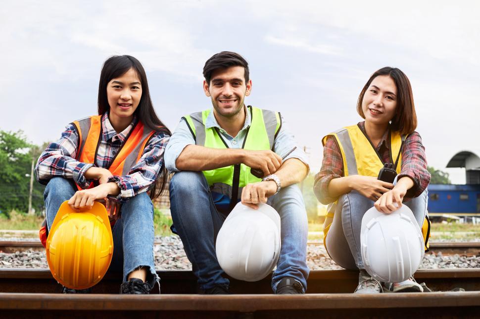 Free Image of Portrait of rail transport specialist engineers on the train tracks 