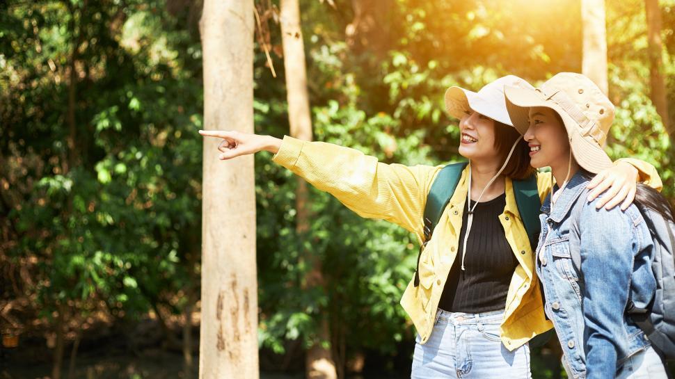 Free Image of Two female travelers enjoy touring in the wild 