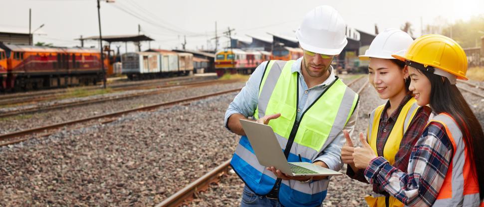 Free Image of Rail logistics engineers are meeting on the train track. 