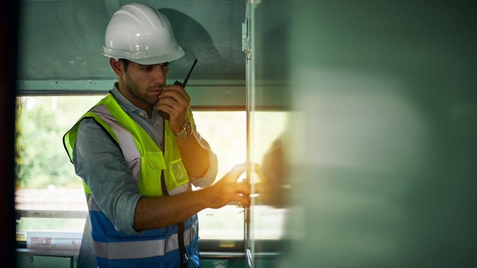 Free Image of Machine operator in safety gear 