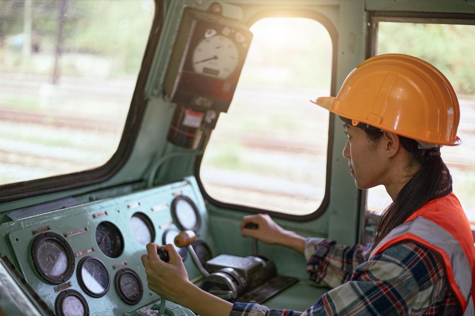 Free Image of The industrial technician is driving the machine 