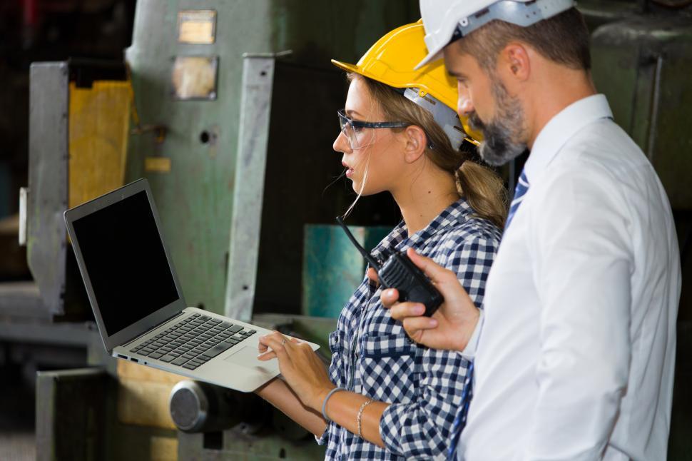 Free Image of Engineer and boss on the factory floor 
