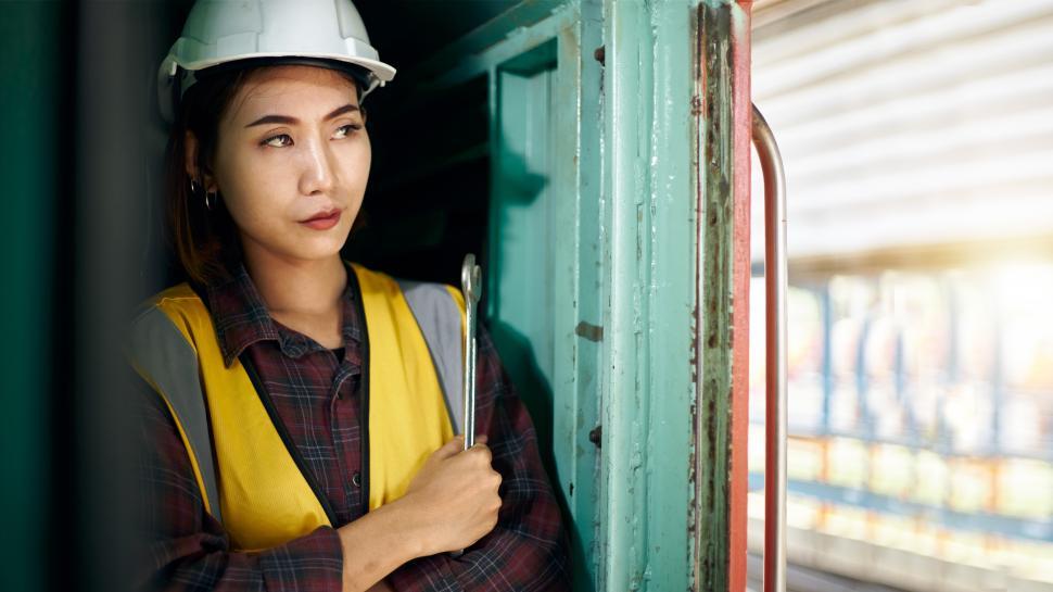 Free Image of Female Maintenance Technician holding wrench 
