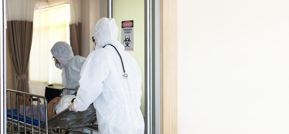Free Image of Patient ill with COVID-19 being wheeled into the hospital 
