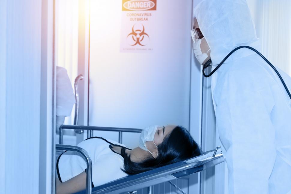 Free Image of Patient being rolled into hospital 